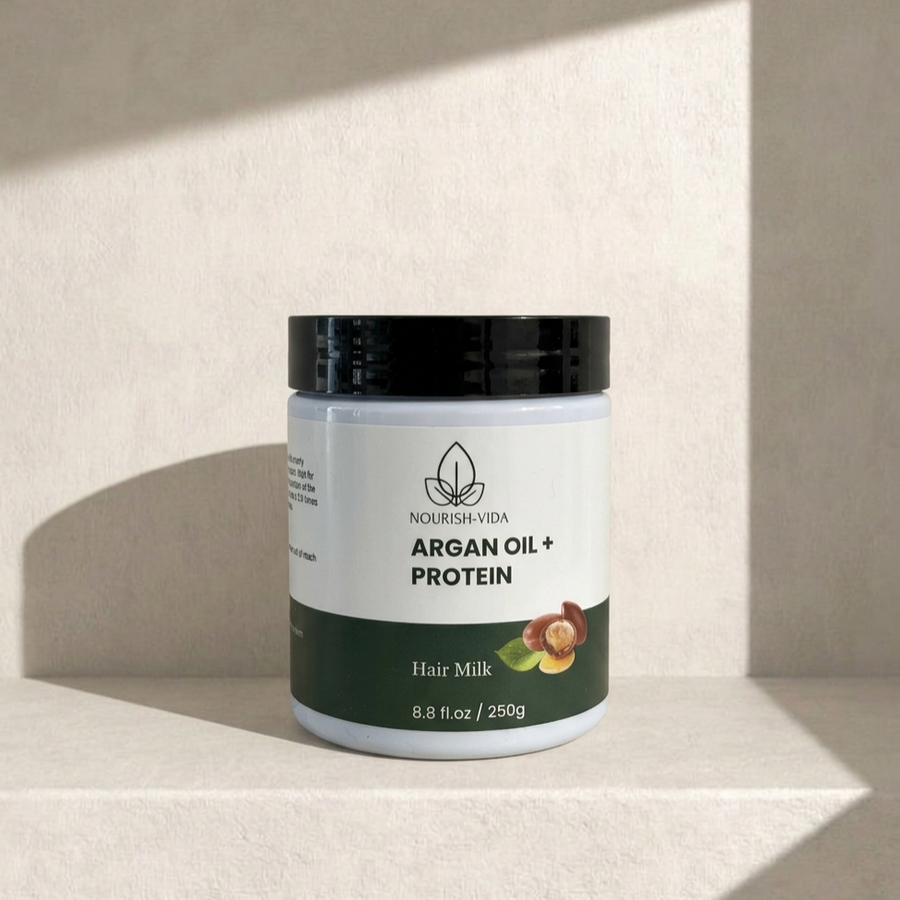 Jar of Nourish Vida Argan Oil + Protein Hair Milk on a beige background