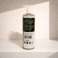 Lotion bottle with label on a textured surface