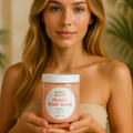 Woman holding a jar of body scrub with a neutral background