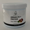 Jar of argan oil protein hair milk on a white background